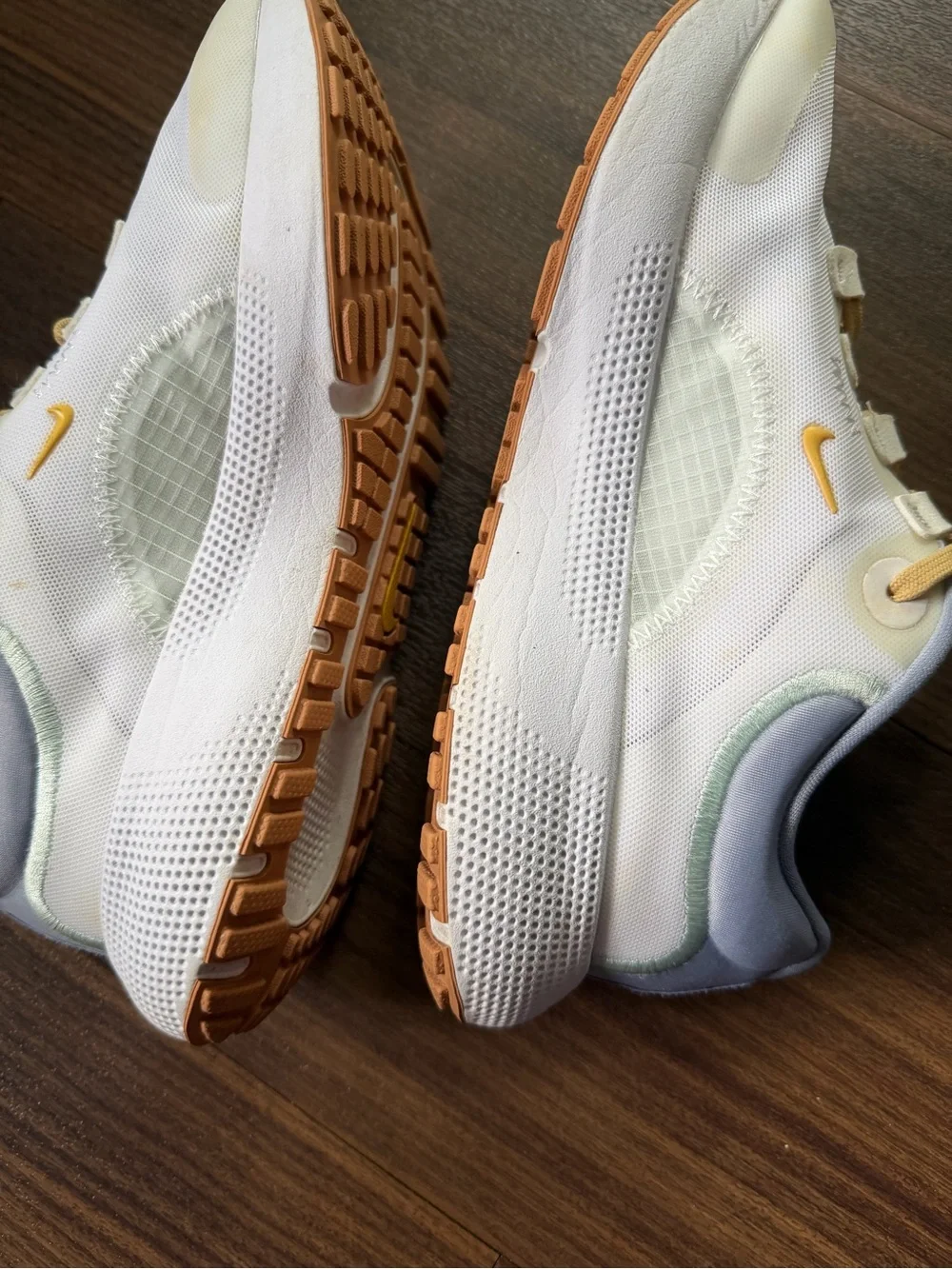 Nike Kids White Sneakers with Pale Yellow Accents